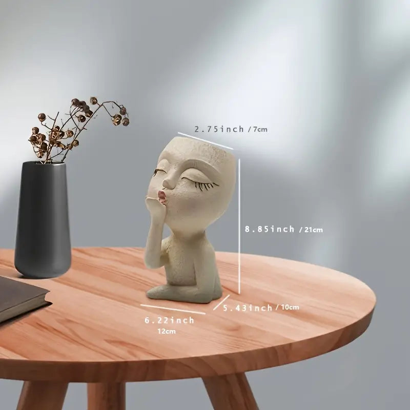 Beige resin face flower pot with playful design – Living Abroad Creations