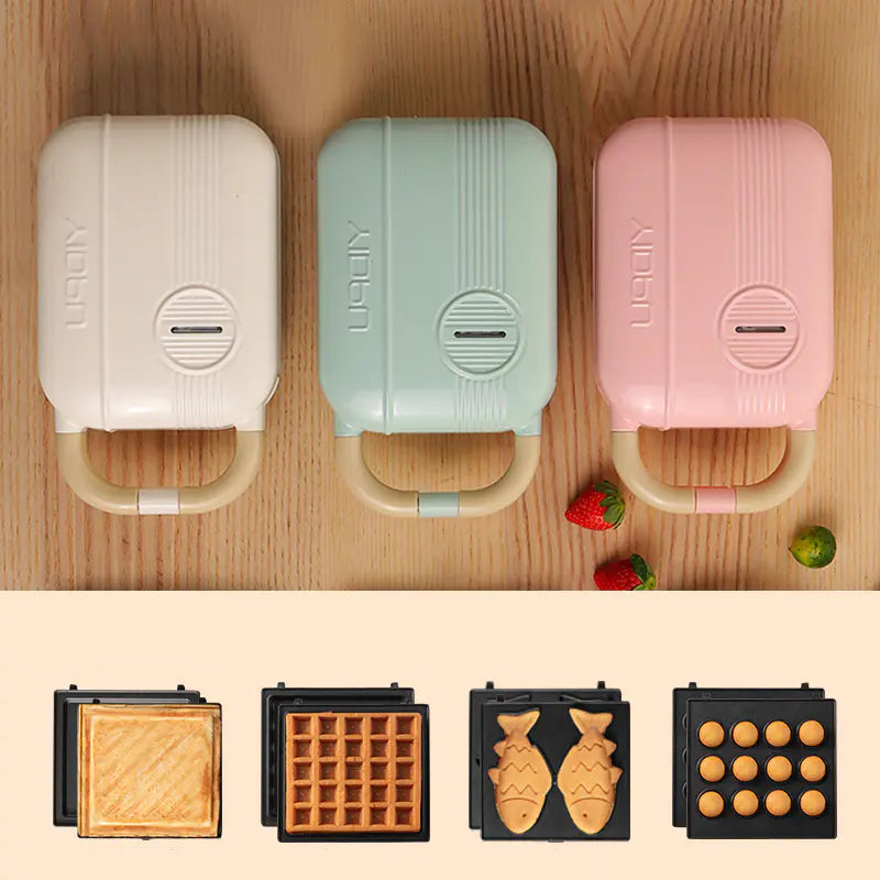 Living Abroad Creations Breakfast Maker in pink, green and white with sandwiches, waffles, fish and muffins