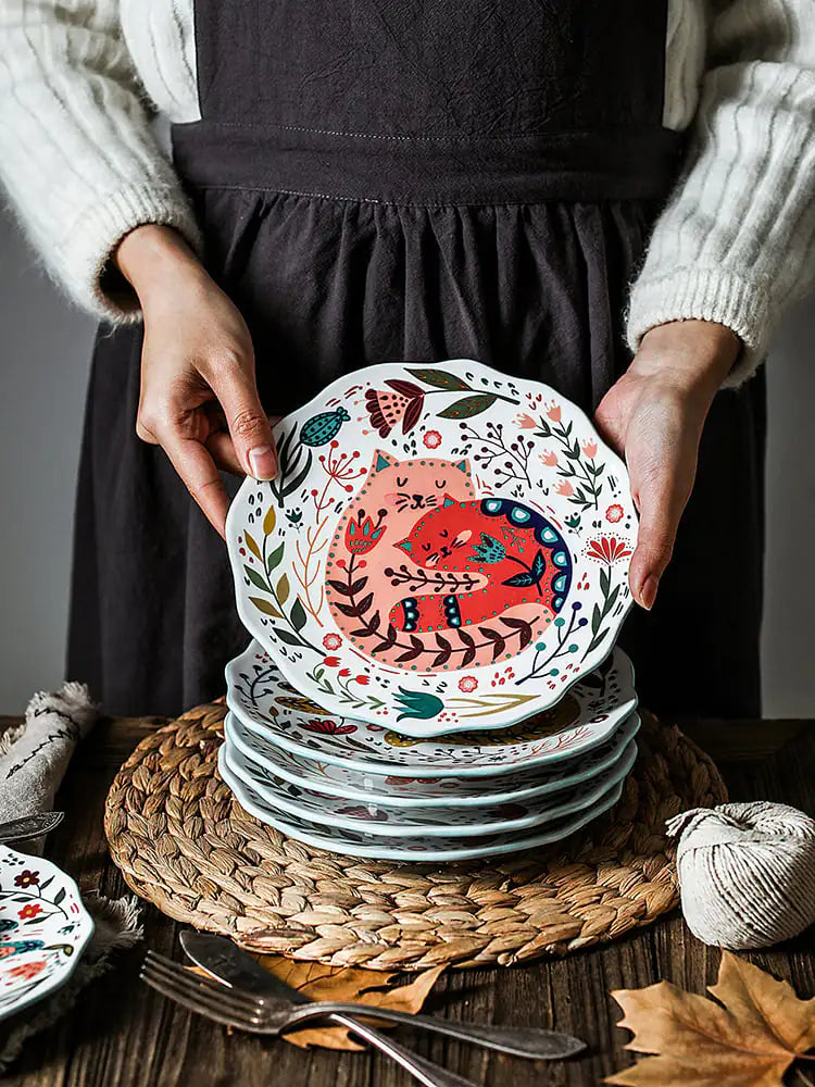 Close-up of cartoon cat design on Living Abroad Creations dinner plate
