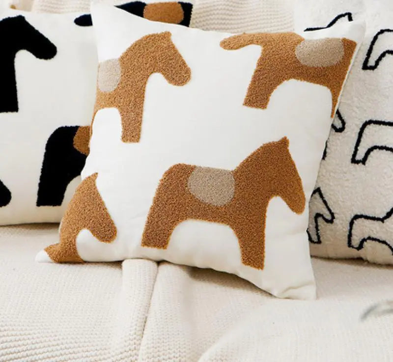 Living Abroad Creations boho embroidered pillow styled with Brown ponies