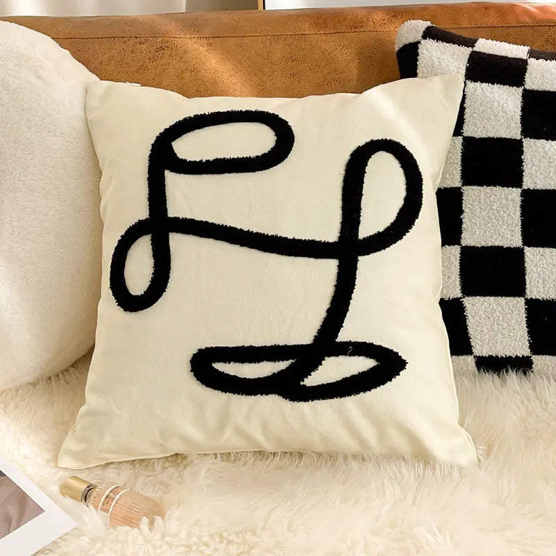 Living Abroad Creations minimalist boho embroidered pillow styled with neutral home decor