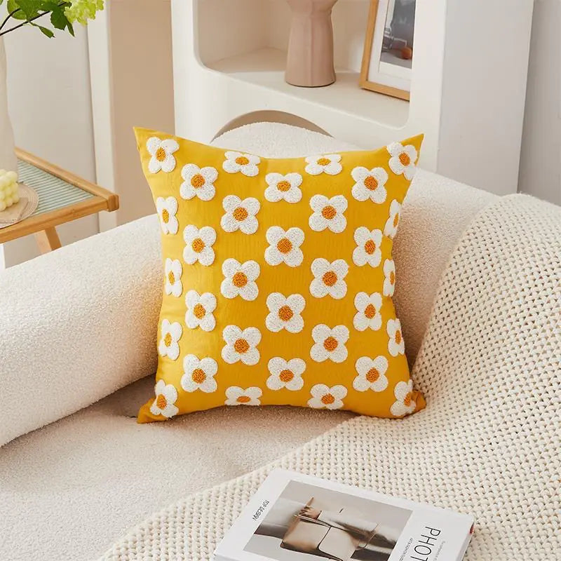 Living Abroad Creations minimalist room featuring a yellow floral pillow