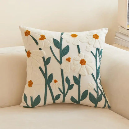 Living Abroad Creations nordic floral pillow on a beige chair