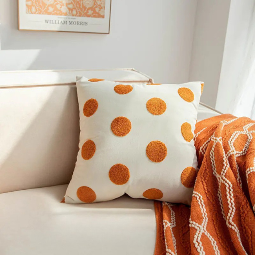 Living Abroad Creations orange polka dot embroidery pillow design close-up