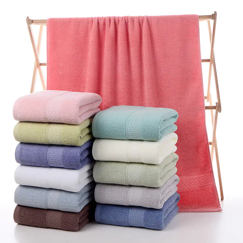 Luxury cotton towels folded neatly on bathroom shelf – Living Abroad Creations