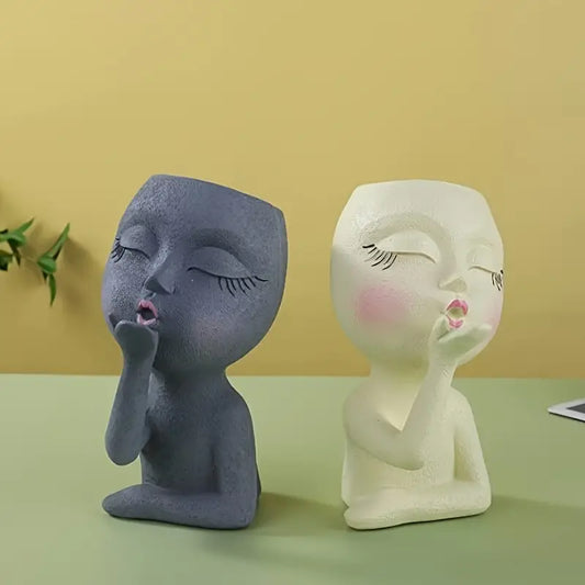 Whimsical resin planter of girl blowing kiss – Living Abroad Creations